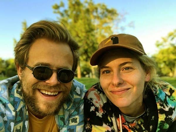 Image of Adam Conover with his wife Lisa Hanawalt